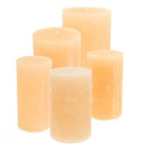 Product Solid colored candles light apricot Different sizes