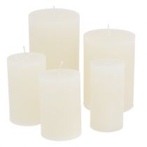 Solid white candles, different sizes