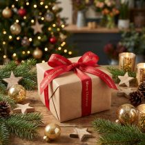 Product Red Christmas ribbon with golden 'Merry Christmas' lettering Width 25mm Length 20m