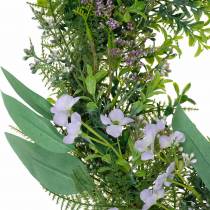 Decorative wreath eucalyptus, fern, flowers. Artificial wreath