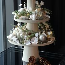 Product Decorative round beige plate with a 40 cm high base