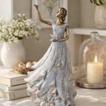 Product Figurine of a woman with a bird. Artfully designed decorative sculpture for timeless design. 41cm
