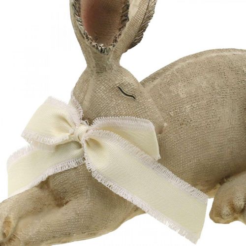 Floristik24 Easter bunny lying with bow Polyresin Easter decoration 28cm