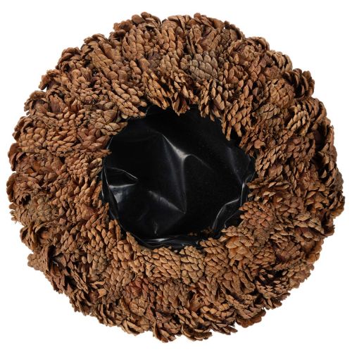Round pine cone pot as a