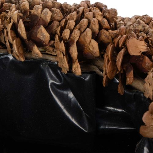 Round pine cone pot as a