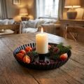 Metal candle holder in cake