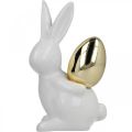 Floristik24 Rabbits with gold egg, ceramic rabbits for Easter noble white, golden H13cm 2pcs