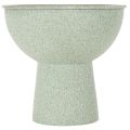 Modern round planter on a high